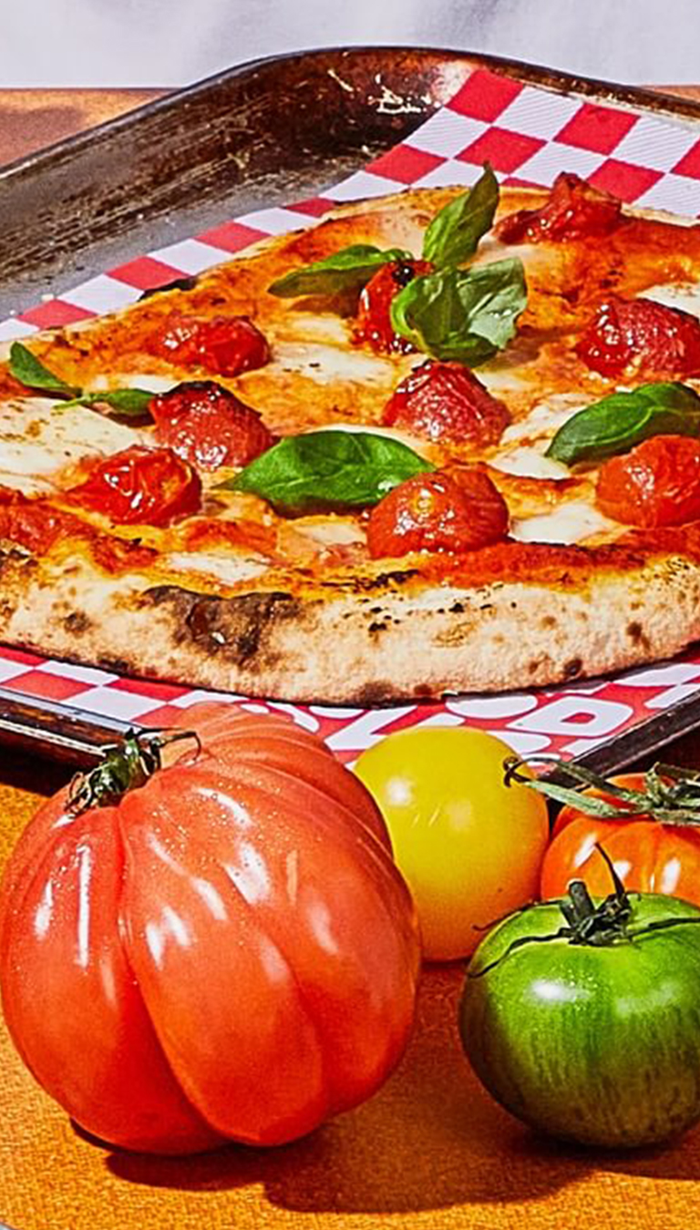 The Good Slice crop Pizza and tomatos